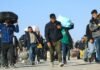 Thousands of Afghans return from Iran amid economic crisis